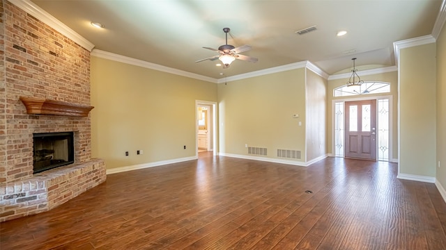 unfurnished living room featuring ornamental molding, a brick fireplace, dark wood-type flooring, and ceiling fan