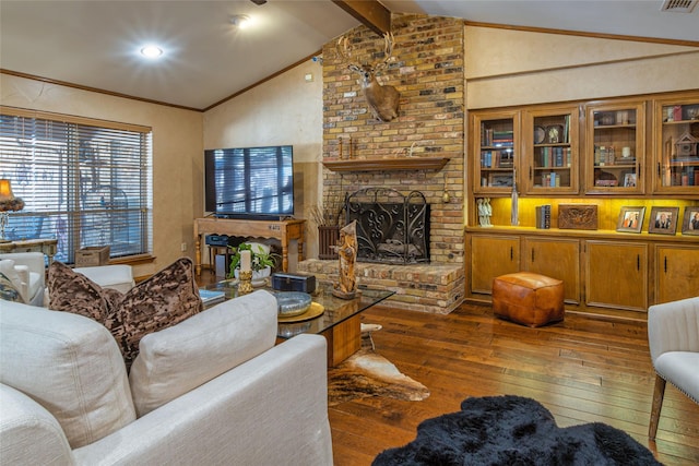 living room with dark hardwood / wood-style floors, a fireplace, lofted ceiling with beams, and crown molding