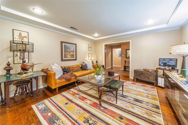 living room with dark wood-type flooring, ornamental molding, and a raised ceiling