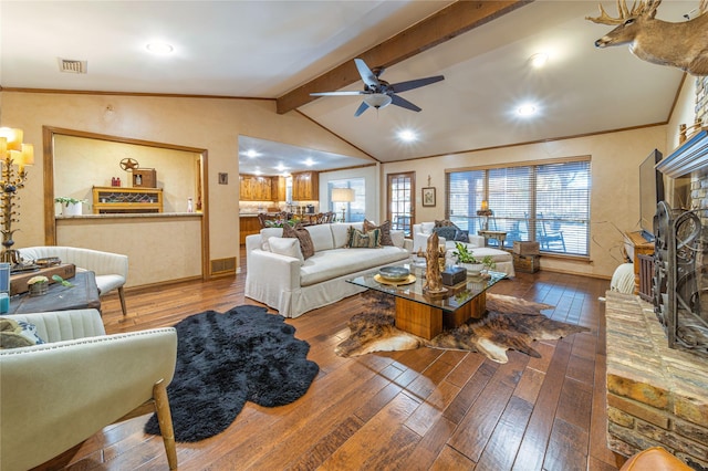 living room with lofted ceiling with beams, ornamental molding, hardwood / wood-style floors, and ceiling fan