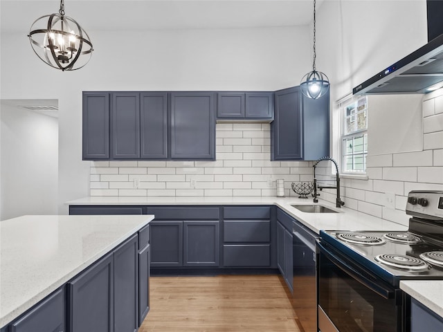 kitchen with sink, pendant lighting, ventilation hood, light wood-type flooring, and range with electric cooktop