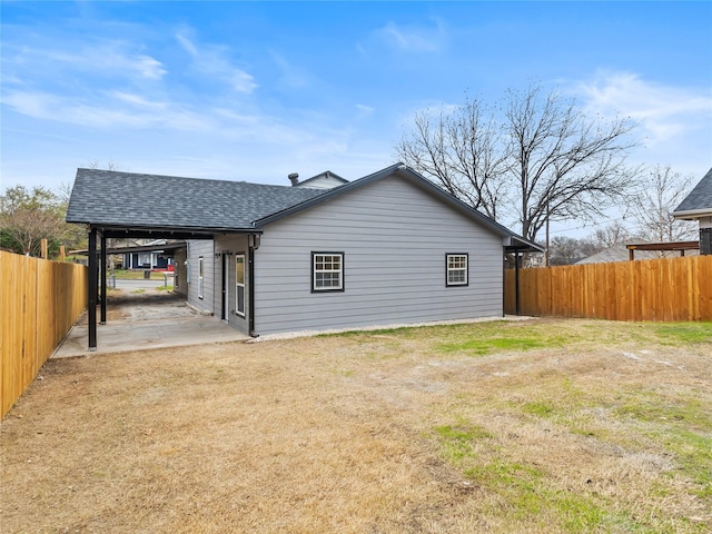 back of property with a patio and a lawn