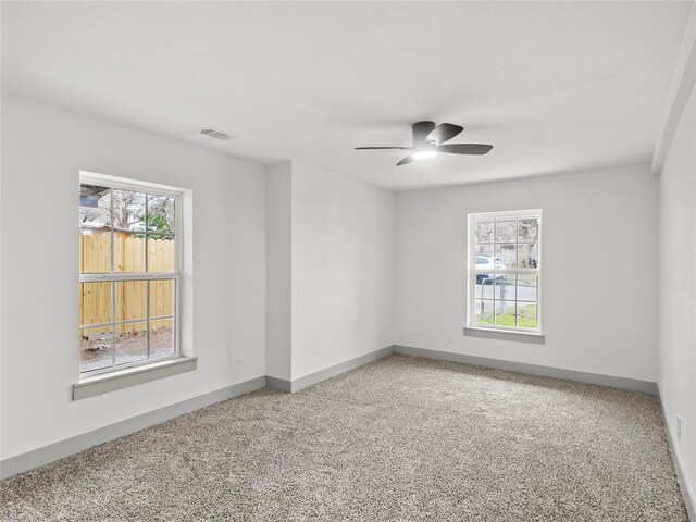 unfurnished bedroom with light colored carpet and ceiling fan