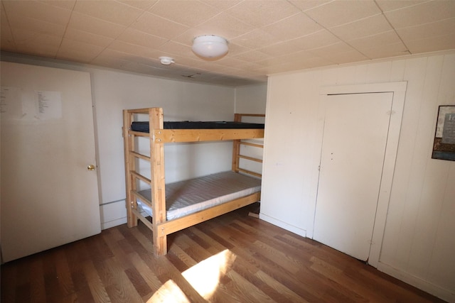 unfurnished bedroom featuring dark hardwood / wood-style flooring