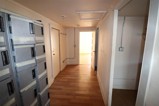 corridor with hardwood / wood-style flooring