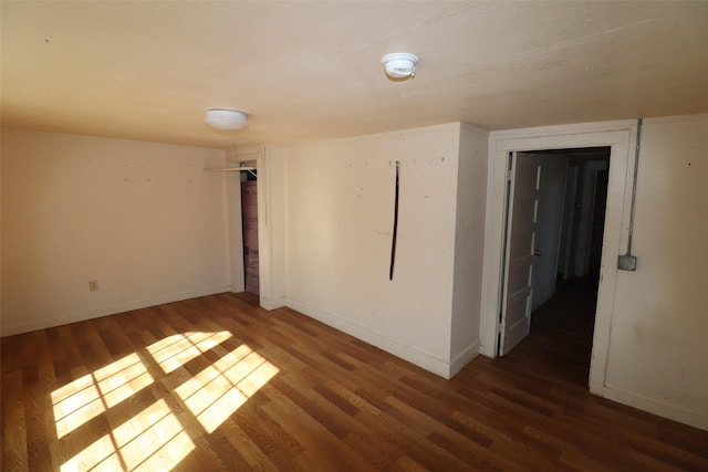 empty room featuring dark hardwood / wood-style floors