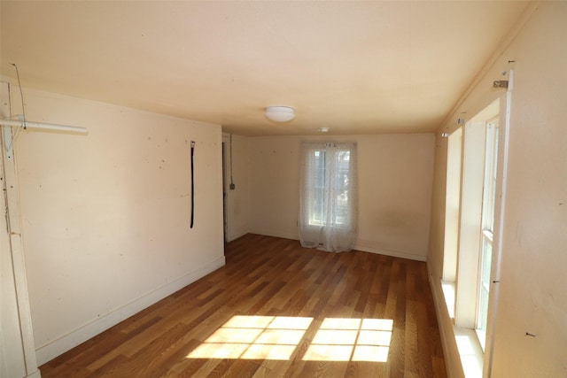 spare room featuring hardwood / wood-style flooring