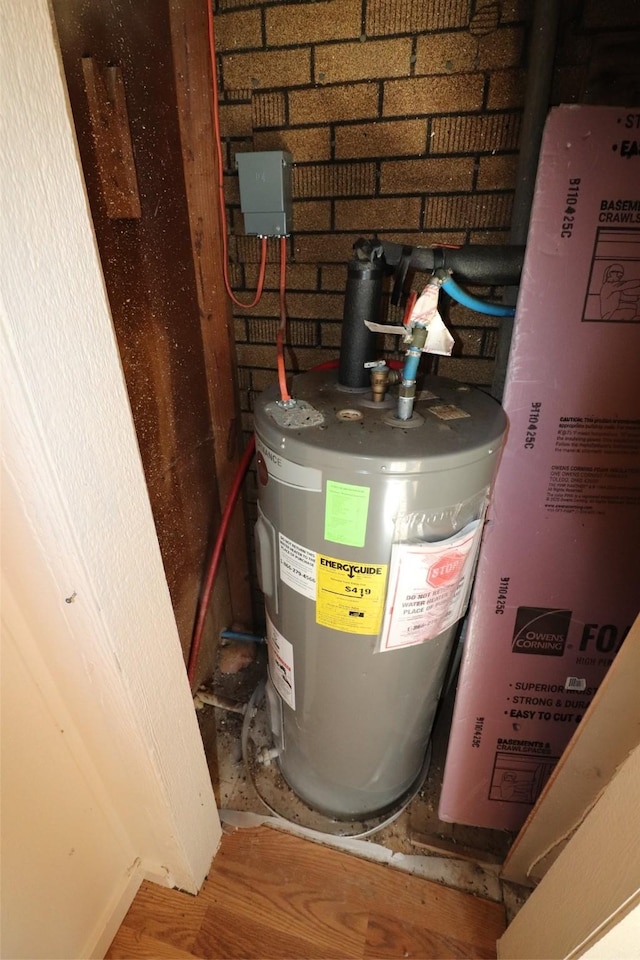 utility room featuring electric water heater