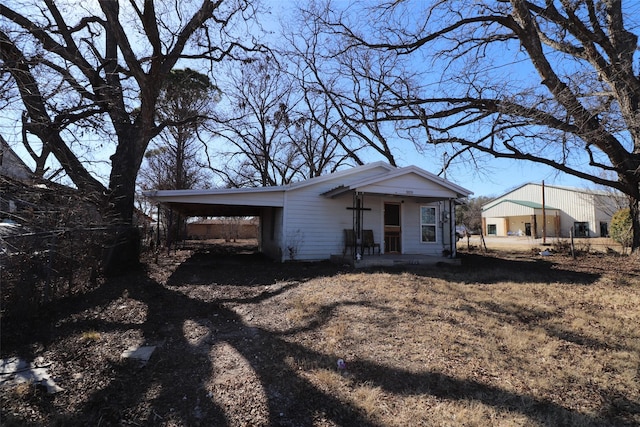 ranch-style home with a carport