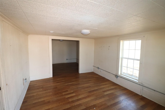 unfurnished room with dark hardwood / wood-style floors