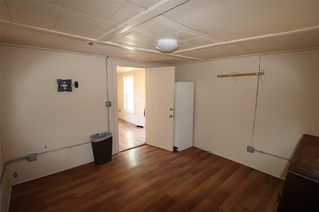 spare room with dark hardwood / wood-style floors