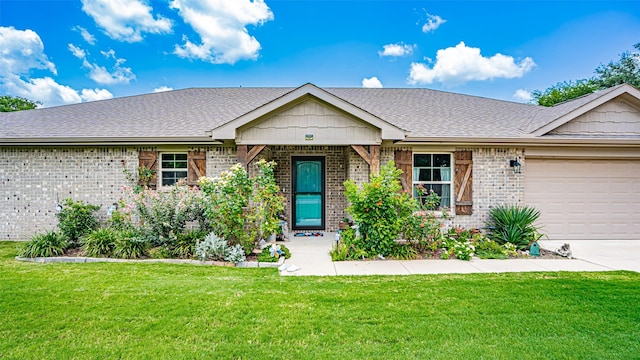 ranch-style house featuring a garage and a front yard