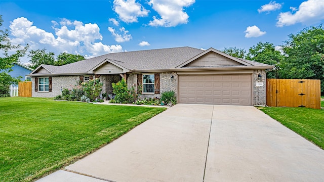 single story home with a garage and a front yard