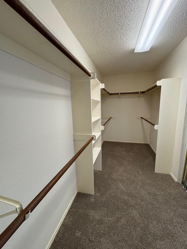 2414 W Stillwater Dr, Mesquite, TX 75181 - walk in closet featuring dark colored carpet