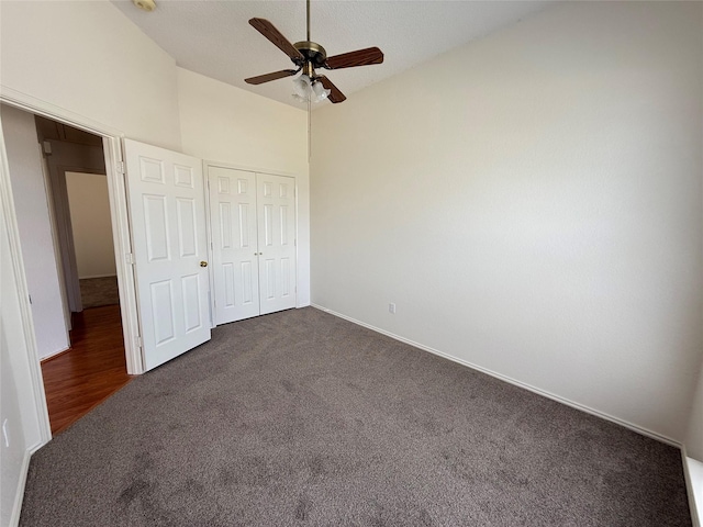 2414 W Stillwater Dr, Mesquite, TX 75181 - unfurnished bedroom featuring dark colored carpet, a closet, and ceiling fan