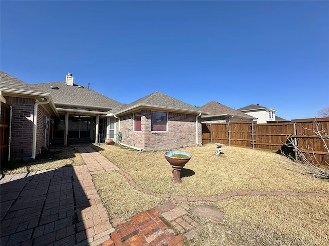 rear view of property with a patio area