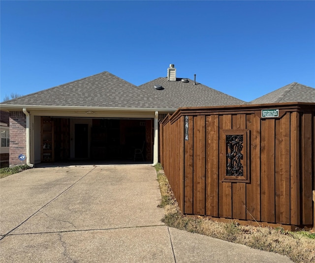 view of property exterior featuring a garage