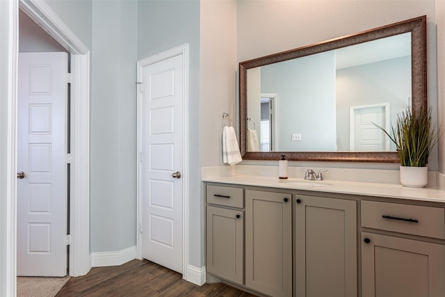 bathroom featuring hardwood / wood-style flooring and vanity