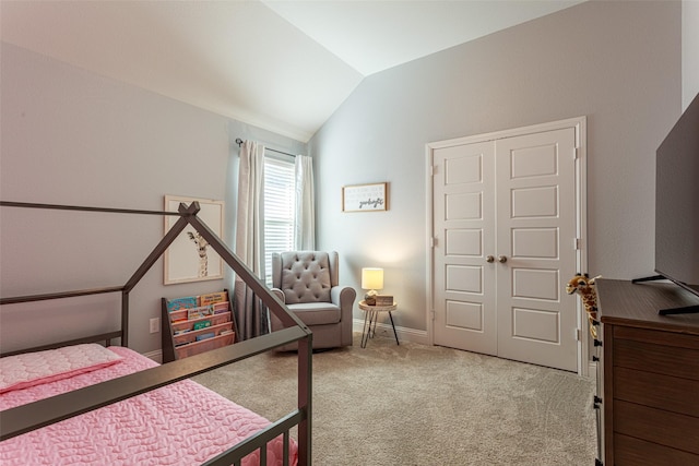 bedroom featuring lofted ceiling and carpet floors