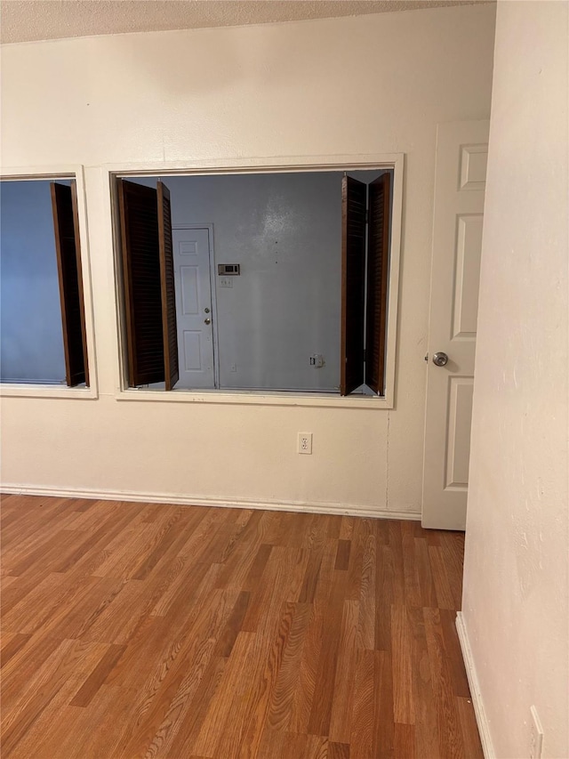 spare room featuring hardwood / wood-style floors