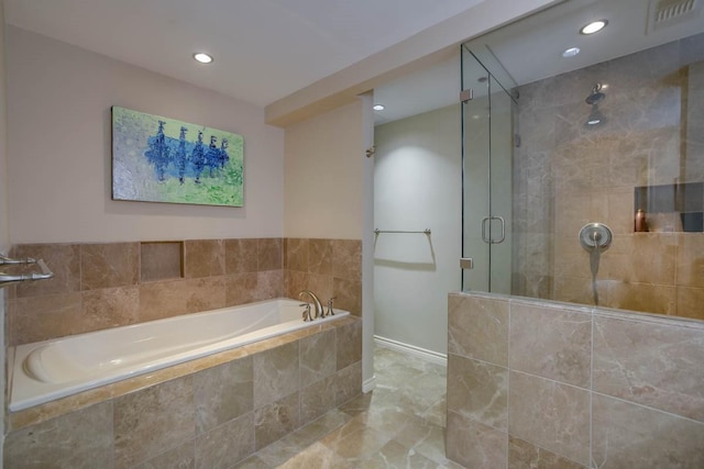 bathroom featuring shower with separate bathtub