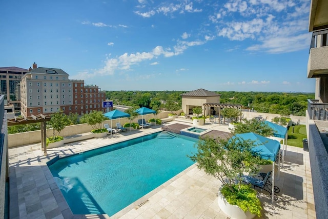 view of pool featuring an in ground hot tub, a pergola, and a patio