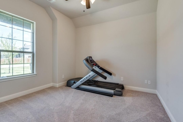 exercise area featuring lofted ceiling, light colored carpet, and ceiling fan