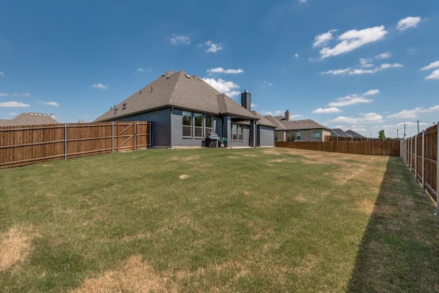 rear view of house with a yard