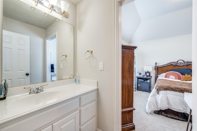 bathroom with vanity and vaulted ceiling