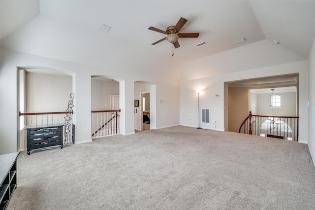 unfurnished living room featuring ceiling fan, lofted ceiling, and carpet floors