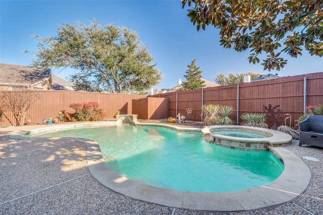 view of pool featuring an in ground hot tub