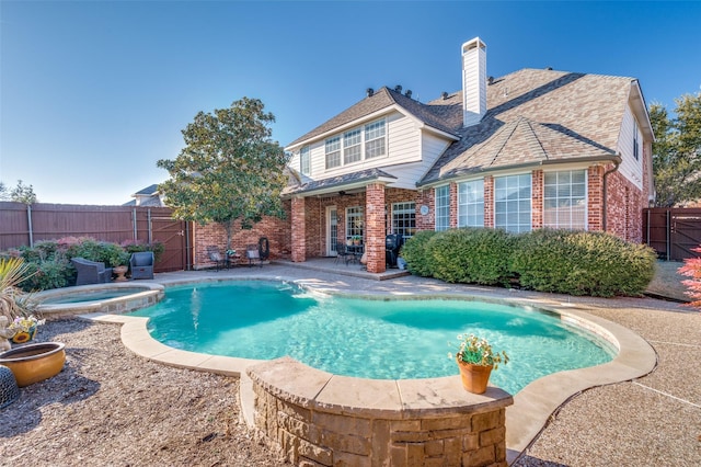 view of pool featuring an in ground hot tub and a patio area