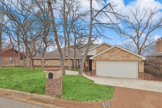 view of front of home with a garage and a front lawn