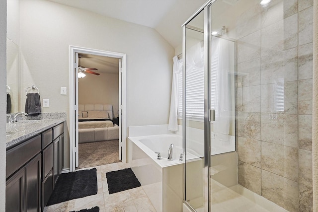 bathroom featuring lofted ceiling, a shower stall, connected bathroom, and a bath