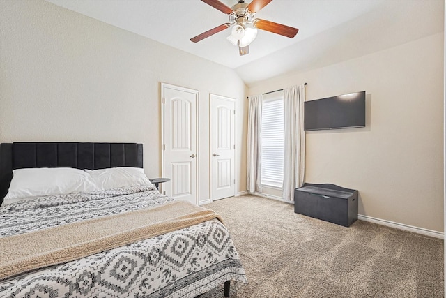 carpeted bedroom with lofted ceiling, ceiling fan, and baseboards