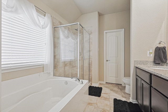 bathroom with a stall shower, a garden tub, vanity, and toilet