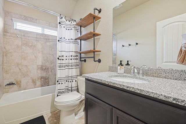 bathroom featuring toilet, shower / bath combo, and vanity