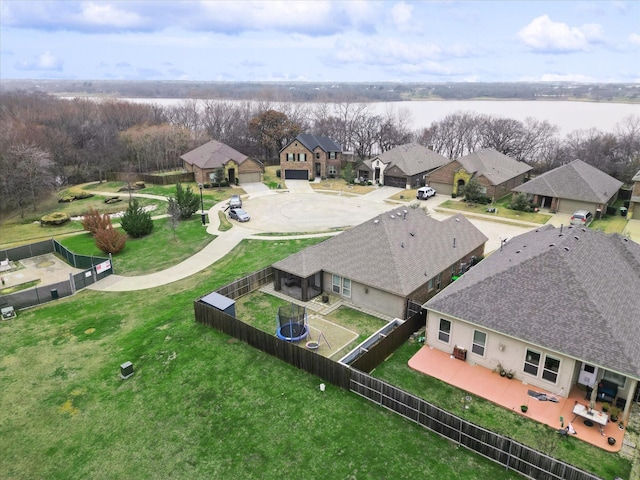 bird's eye view featuring a water view and a residential view