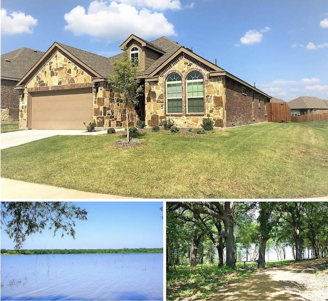 exterior space featuring stone siding, a water view, driveway, and a front lawn