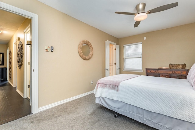 bedroom with ceiling fan and dark carpet