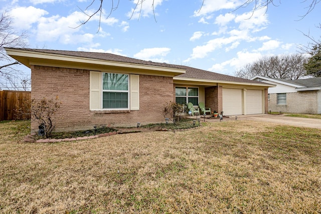 ranch-style home with a garage and a front yard