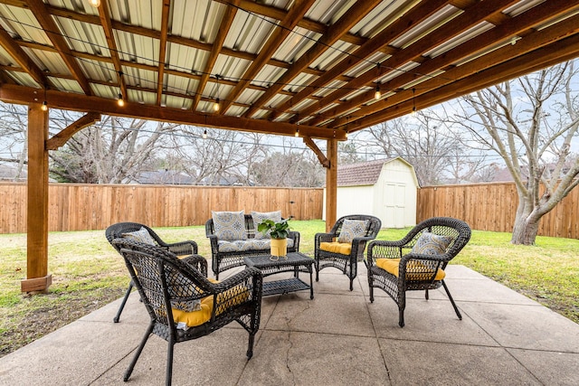 view of patio with a shed and an outdoor living space