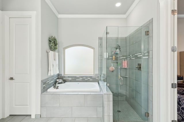 bathroom featuring crown molding and shower with separate bathtub