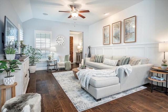 living room featuring dark hardwood / wood-style flooring, lofted ceiling, and ceiling fan