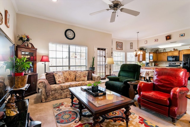 living room with crown molding, ceiling fan with notable chandelier, and light carpet