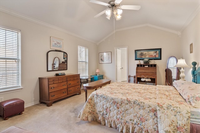 carpeted bedroom featuring multiple windows, vaulted ceiling, ceiling fan, and crown molding