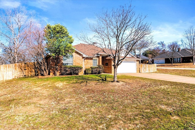 view of front of property with a garage and a front yard