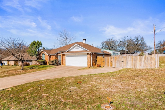 view of front of house featuring a garage and a front yard