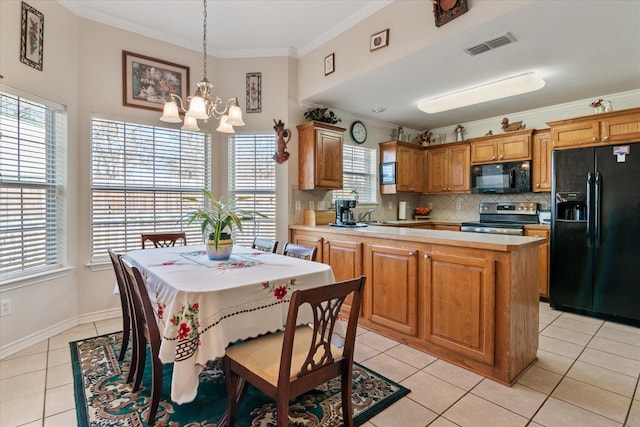 kitchen featuring light tile patterned floors, a center island, ornamental molding, black appliances, and decorative light fixtures