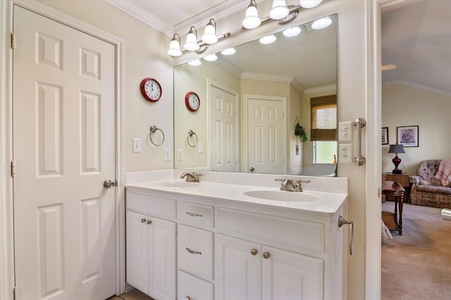 bathroom with crown molding and vanity